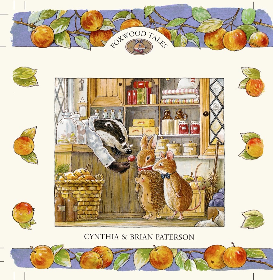 Cover artwork of Robbery at Foxwood: a badger shopkeeper and two mice in a village store, framed by an apple garland